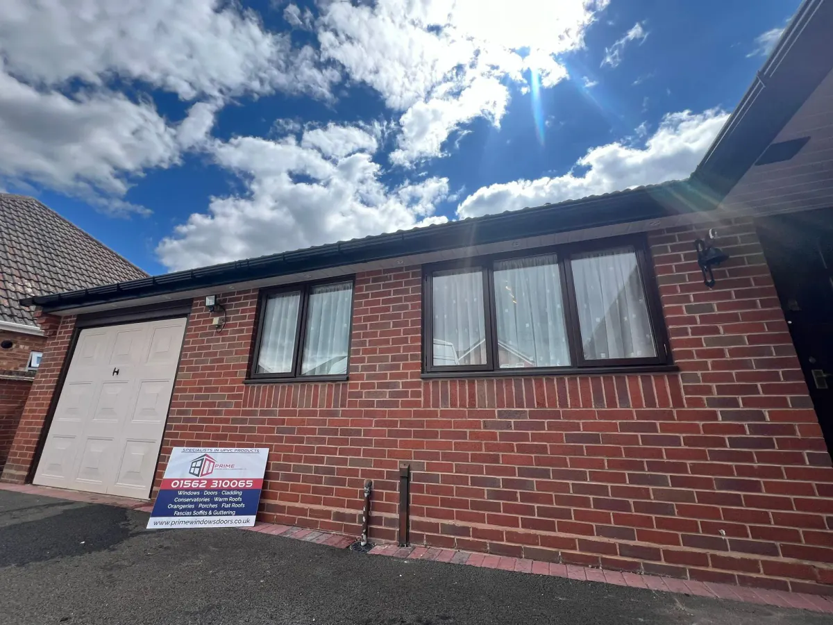 Black fascias, soffits and guttering installed on a brick home
